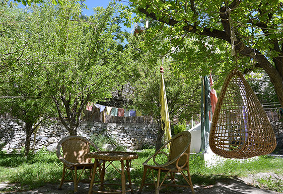 Relax in our garden's hammocks & cots with a book